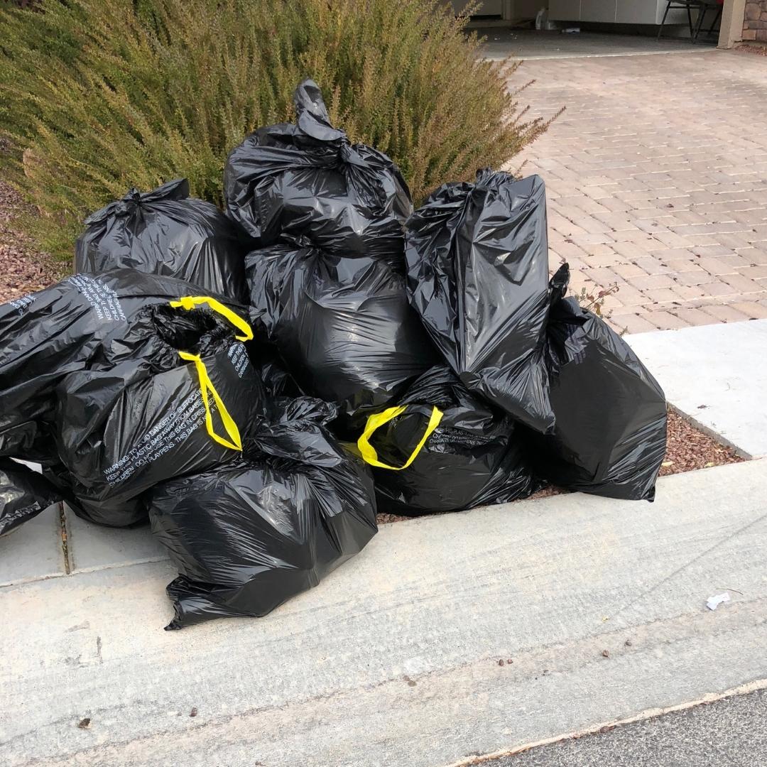 Extra black trash bags on the curb during Spring Cleanup