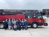 Public Safety Academy class standing in front of a fire truck.